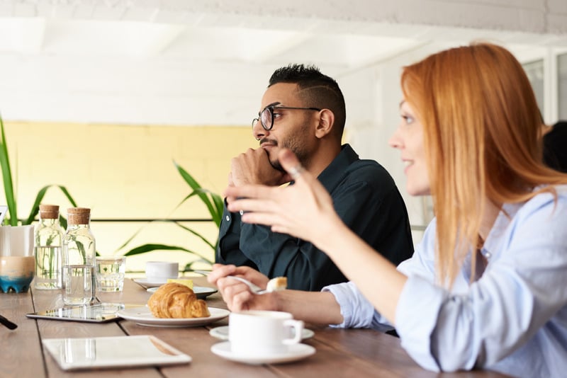 Photo Of Man Sitting Beside Woman