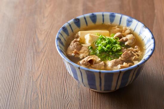 Bowl of Japanese Miso Soup with Beef and Green Onions
